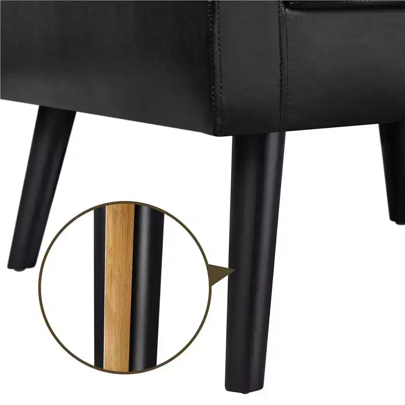 Poltrona moderna in similpelle trapuntata con gambe in legno massello