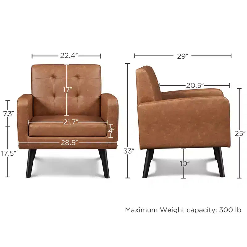 Poltrona moderna in similpelle trapuntata con gambe in legno massello